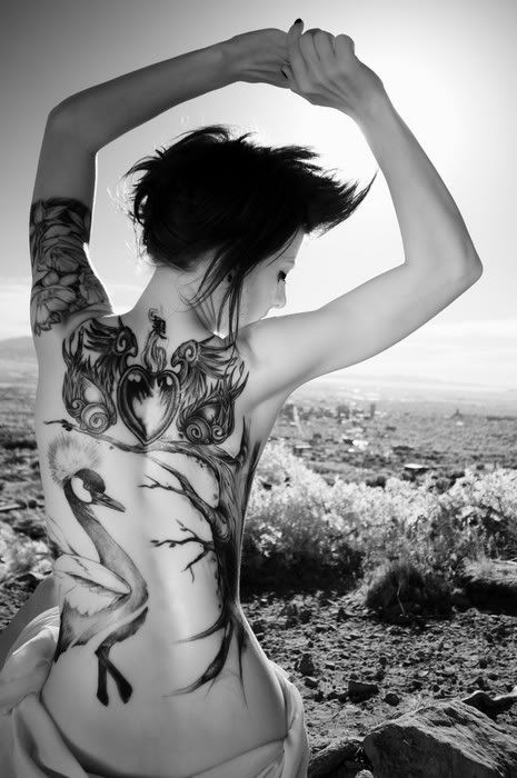 TATTOO NEW MODELS 2010 Feminine Tattoo Pictures The merciless glare of the 