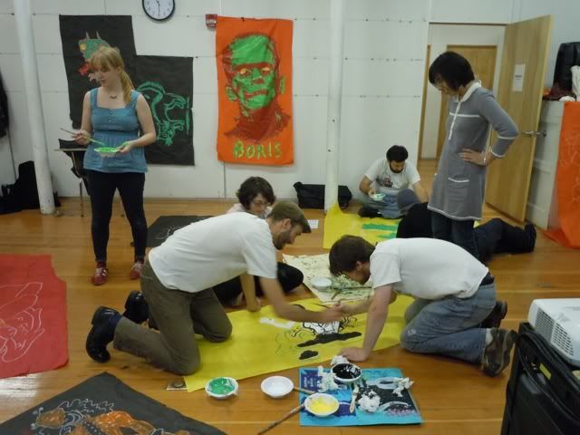 classmates painting monsters