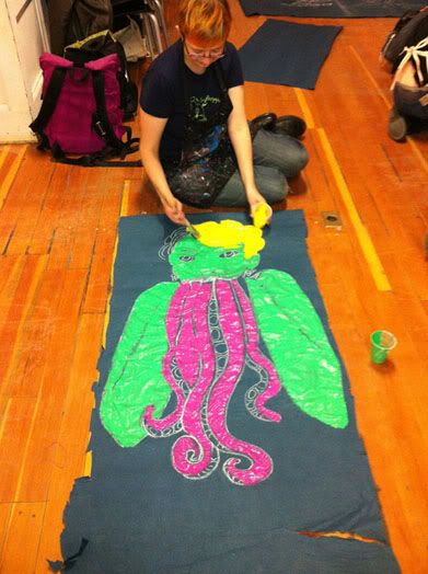 photo of me painting a woman with tentacles dangling from her grinning mouth